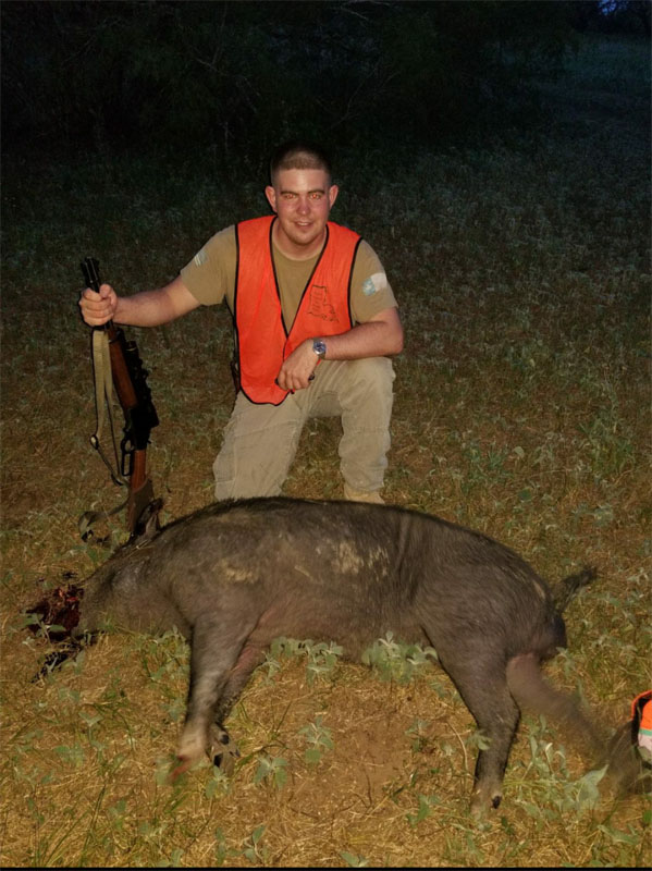 V. McNeal's Son with Boar hog taken with 30-30 and 150gr HP lead bullet.